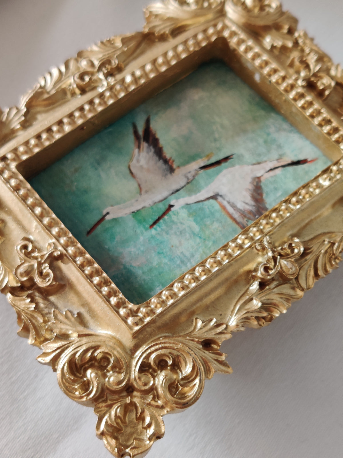 Flying storks at mid day light | Framed Original