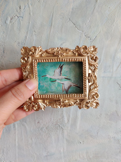 Flying storks at mid day light | Framed Original