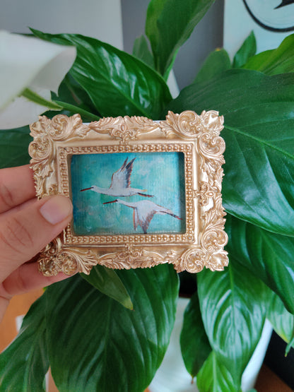 Flying storks at mid day light | Framed Original