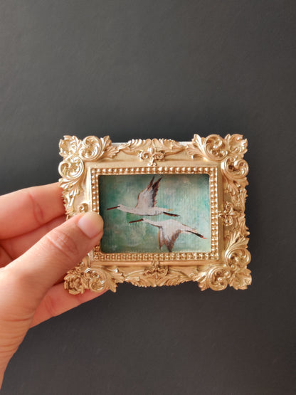 Flying storks at mid day light | Framed Original