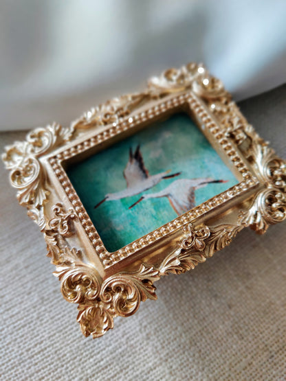 Flying storks at mid day light | Framed Original